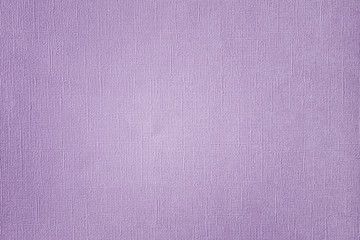 Texture of purple paper with irregularities and embossed close-up. Background for layouts.