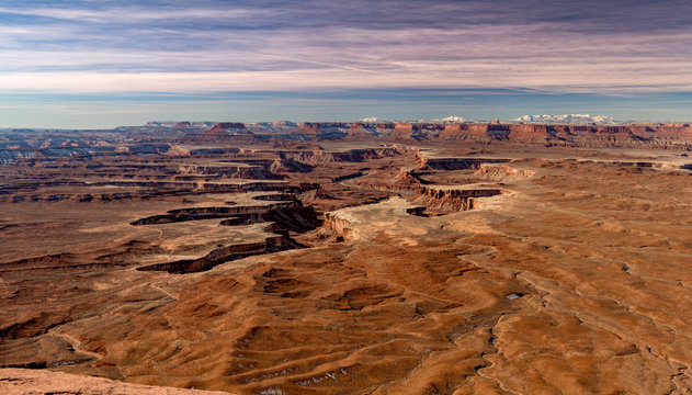 Scenic View Of The Canyonlands In Utah Winter With Light Clouds Overhead