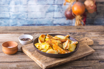 Crisp golden deep fried, french fries hot potatoes, frying and ready to be eaten, really yummy. Fried potatoes in the old cast-iron pan