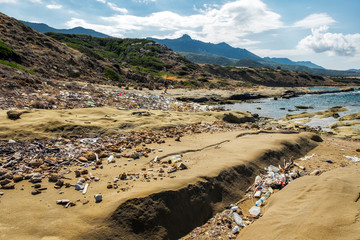 Dirty coastline of Cyprus island, pollution washing on the shores