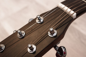 Wooden guitar Silver strings. Musical instrument. Romantic music. Guitar neck.