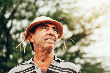 Portrait of Brazilian Northeastern cowboy wearing his typical leather hat. - obrazy, fototapety, plakaty