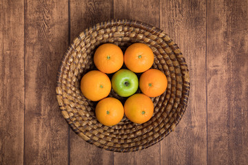 Fruit basked with apples and oranges
