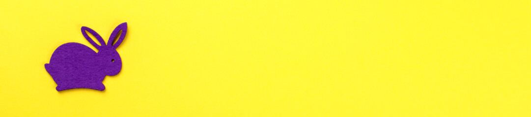 Easter background.Rabbits colored decorative on yellow paper. Happy Festive concept.Top View. Flat Lay.Copy space for Text