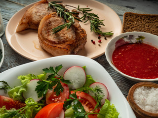 Pork loin with onion, pepper, garlic and vegetables