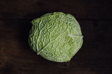 Close up of head of fresh, green savoy cabbage with its crinkled leaves, a healthy winter...