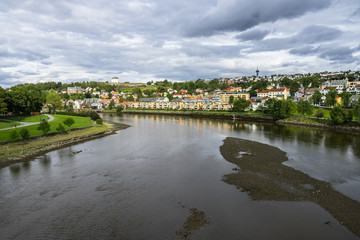 Fototapeta na wymiar Trondheim city with Nidelva River and Kristiansten Fortress on a hill in the background, Norway