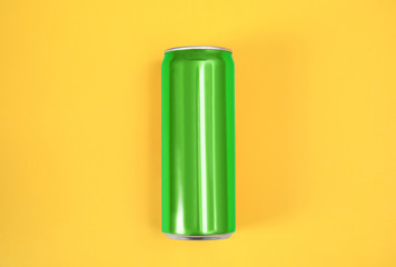 Blank metal green can on color background, top view. Mock up for design