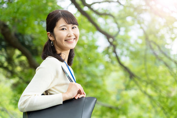 Fototapeta premium portrait of young asian woman in park