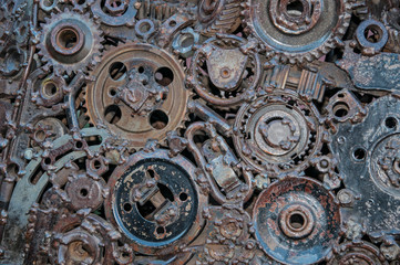 Fototapeta na wymiar Old, worn, rough mechanical gears made of rusty metal. Design minimalism. Iron composition. Retro style. Stylish top and trendy design background round gears.
