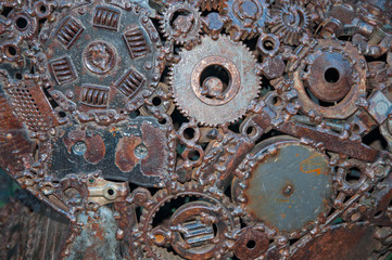 Old, worn, rough mechanical gears made of rusty metal. Design minimalism. Iron composition. Retro style. Stylish top and trendy design background round gears.