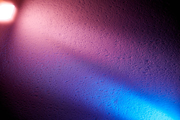 Purple and blue light beam shine to meet each other