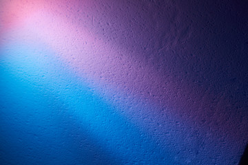 Rays of light on the background a blue violet and dark violet color