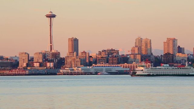 Seattle skyline, Space Needle and Washington State ferry at sunset