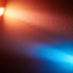 The light of the lanterns of cream and blue light divide the background into two parts