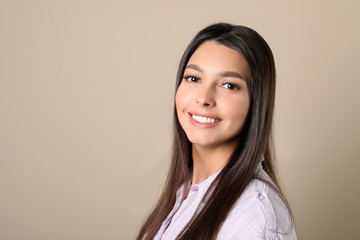 Fototapeta premium Young woman with healthy teeth on color background. Space for text