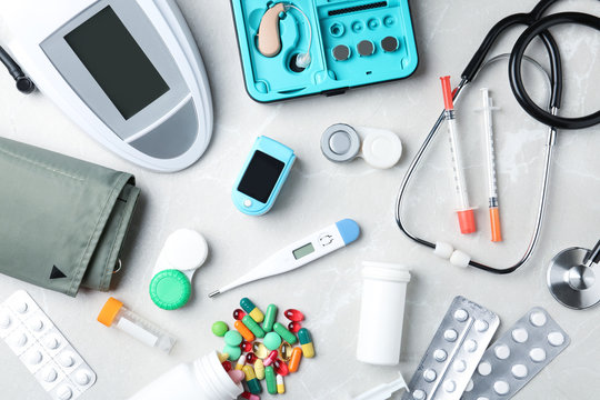 Flat lay composition with medical objects on grey background