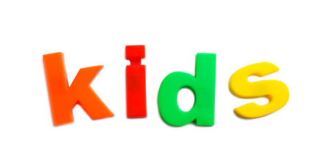 Word KIDS of magnetic letters on white background, top view