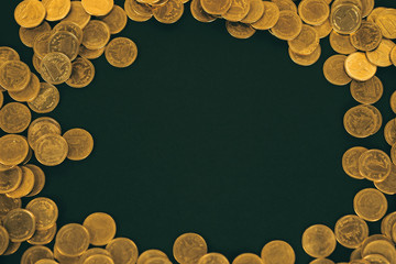 Piles of coins on black background, business and financial concept.