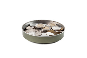 Can with coins of different countries on a white isolated background