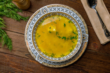 Chicken soup bouillon in a plate
