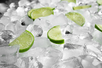 Fresh lime slices on pile of ice cubes