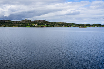 Fjord landscape along the Atlantic coast of southern Norway viewed from cruise ship