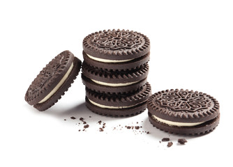 Tasty chocolate cookies and crumbs on white background