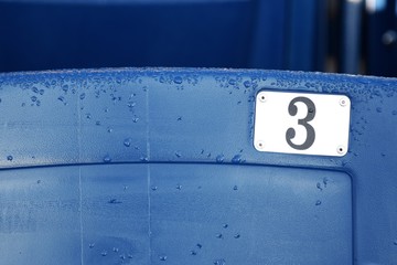Blue stadium seat number 3 birthday or anniversary concept