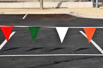 Fototapeta premium colorful pennants in a parking lot