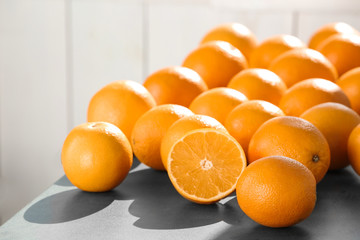 Fresh juicy oranges on table, space for text. Healthy fruits