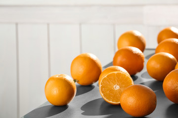 Fresh juicy oranges on table, space for text. Healthy fruits