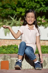 Fototapeta premium Sitting Youthful Minority Female