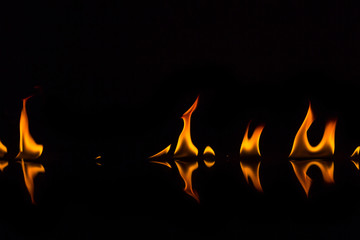 Fire flames on a black