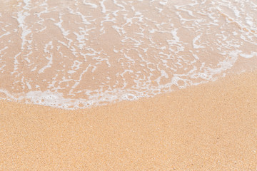 Wave of the sea on the sandy beach