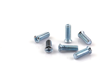 screwed screws nuts against isolated on white