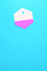 hexagon paper tag on blue background vertical template