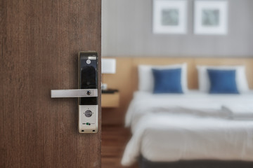 Hotel room opened with digital door access control, Condominium or apartment doorway with open door...