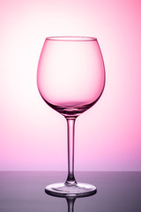 glass of wine isolated on pink background