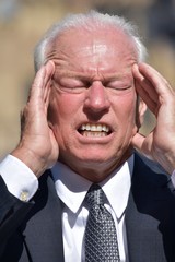 Investor Under Stress Wearing Suit And Tie