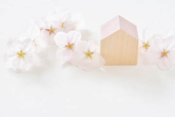 新生活イメージ　家と桜の花