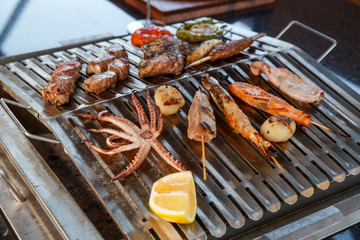 grilled sea food and vegetables on the grill