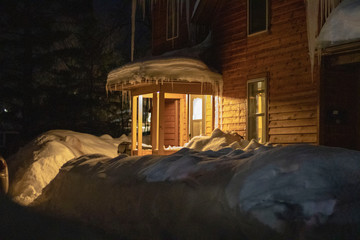 old house in the night during the winter