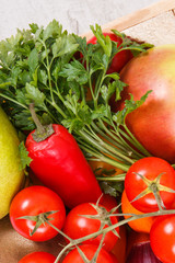 Fresh fruits and vegetables in wooden box. Food containing healthy minerals and vitamins