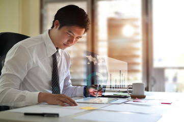 Businessman working with analysis data on digital tablet.