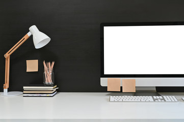 Workspace blank screen desktop computer, Mockup computer, lamp and home office accessories on white desk. - obrazy, fototapety, plakaty