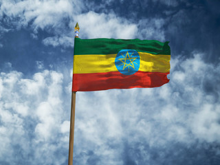 Ethiopia flag Silk waving flag of Ethiopia made transparent fabric with wooden flagpole gold spear on background sunny blue sky white smoke clouds real retro photo Countries of world 3d illustration