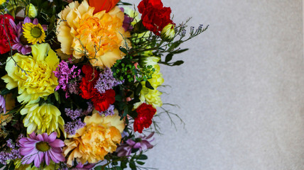 Bright colored spring bouquet on  light background, with  place for text.