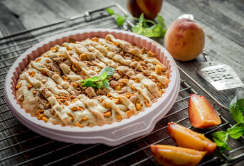 peach pie on an old wooden table