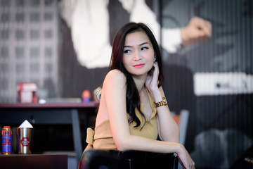 Asian pretty and sexy portrait girl has relaxing at coffee cafe restaurant.